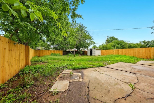 1731 Carlisle Rd, The Village, OK 73120 - fenced backyard featuring a storage unit, an outdoor structure, and a patio area
