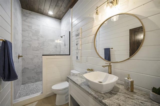 full bathroom featuring wood ceiling, toilet, vanity, and walk in shower