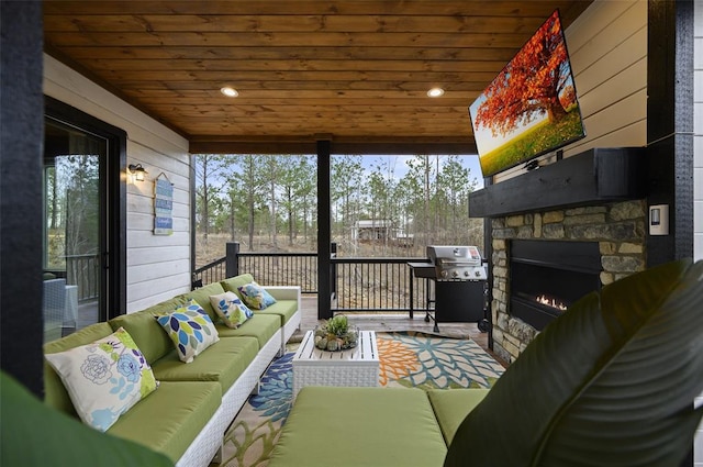 exterior space with wood ceiling and an outdoor stone fireplace