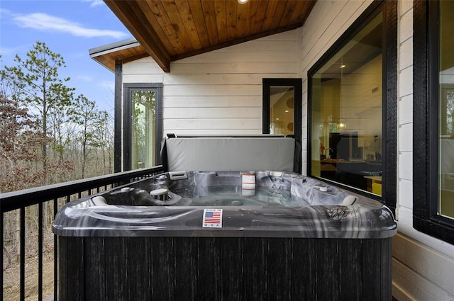 view of patio / terrace with central AC unit and a hot tub