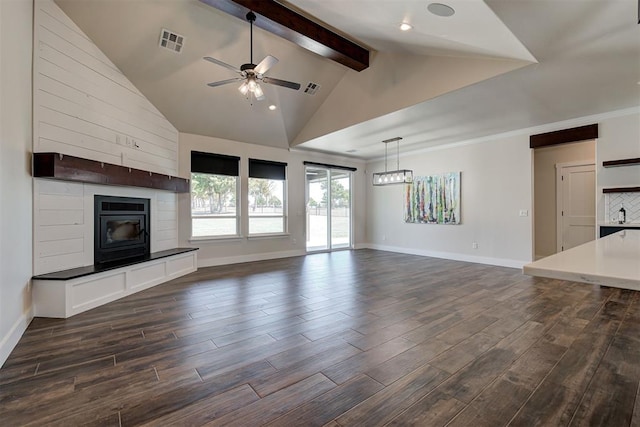 unfurnished living room with lofted ceiling with beams, visible vents, a ceiling fan, and dark wood-style flooring