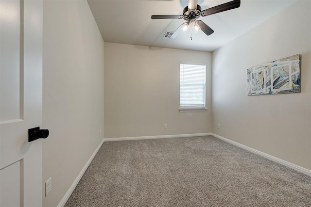 spare room featuring visible vents, a ceiling fan, baseboards, and carpet floors