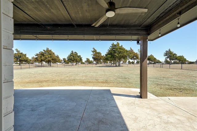 view of patio with a fenced backyard and a ceiling fan