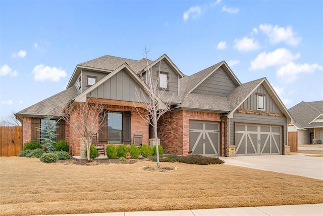 craftsman inspired home with covered porch, concrete driveway, a shingled roof, and board and batten siding