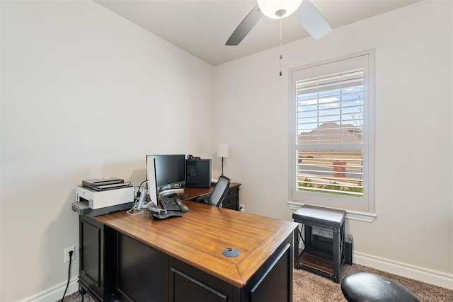 office area with baseboards, light carpet, and ceiling fan