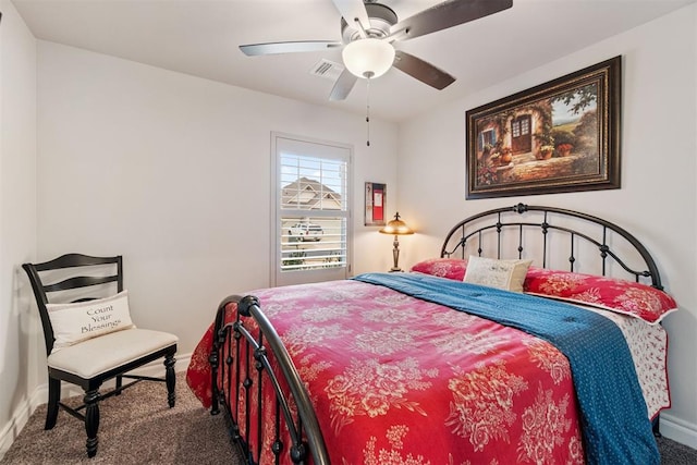 bedroom with carpet flooring, baseboards, visible vents, and a ceiling fan