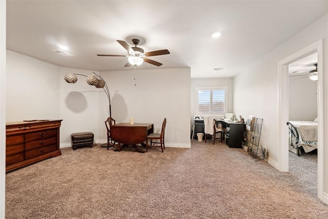 interior space with carpet flooring, visible vents, baseboards, and ceiling fan