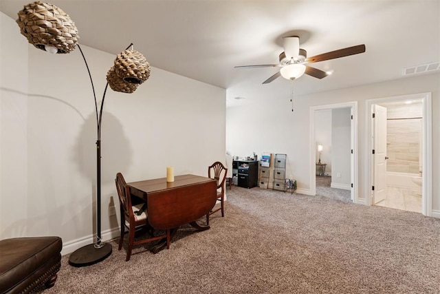 dining space with visible vents, baseboards, carpet, and a ceiling fan