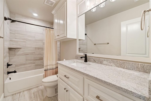 bathroom featuring vanity, visible vents, shower / bath combo, toilet, and marble finish floor