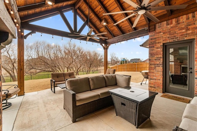 view of patio / terrace with a gazebo, a fenced backyard, outdoor lounge area, and ceiling fan