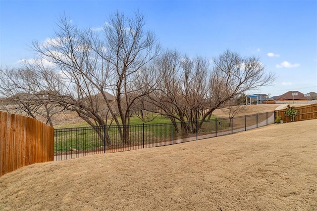 surrounding community featuring a lawn and fence