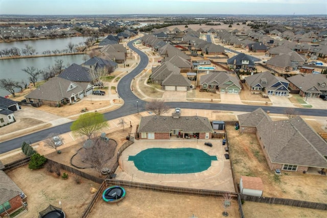 bird's eye view with a residential view and a water view