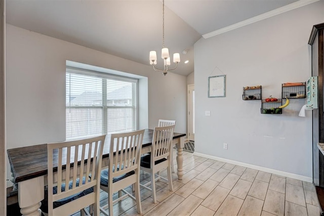 dining room with baseboards, a notable chandelier, wood tiled floor, and vaulted ceiling