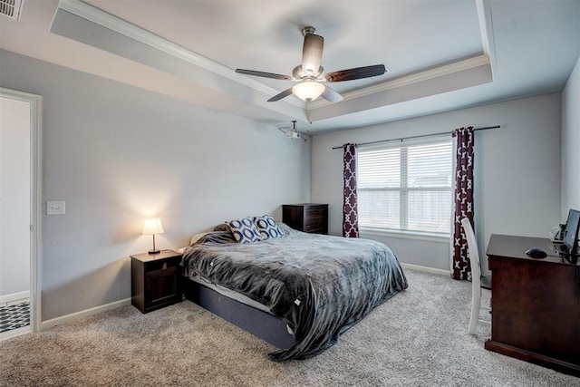 carpeted bedroom with crown molding, a raised ceiling, and baseboards