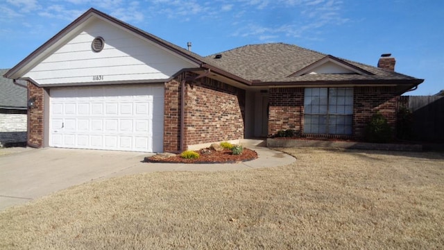 single story home featuring brick siding, an attached garage, and driveway