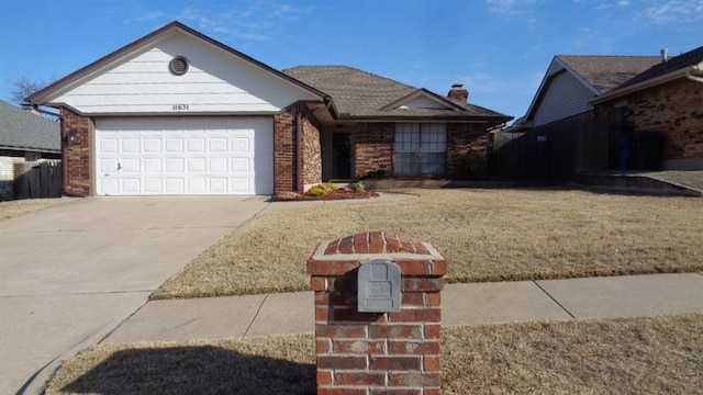 ranch-style home with concrete driveway, an attached garage, brick siding, and a chimney