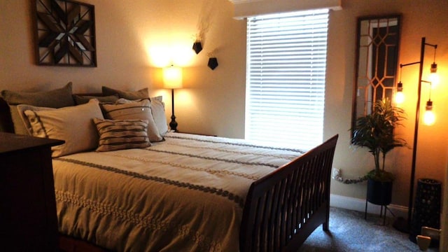 bedroom featuring baseboards and carpet flooring