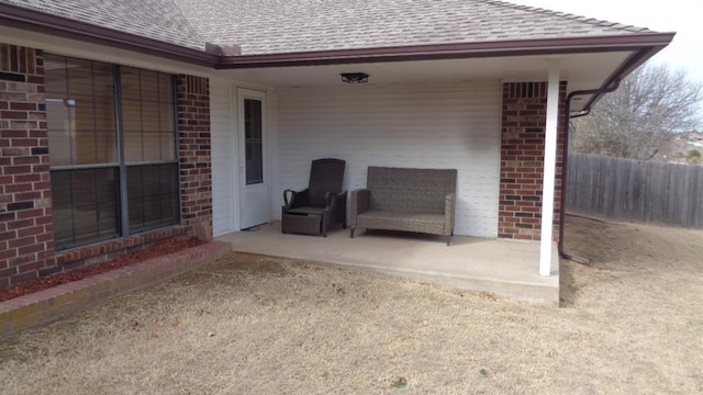 view of patio / terrace featuring fence