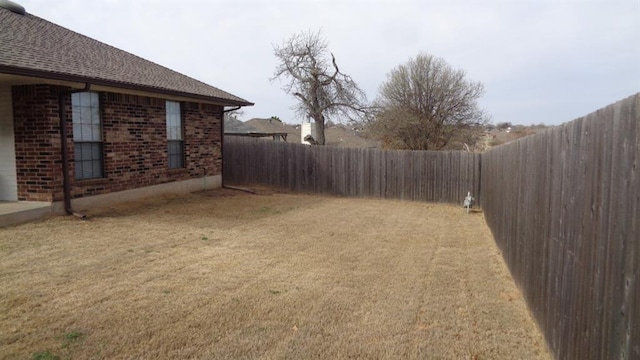 view of yard featuring a fenced backyard