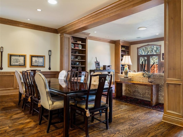 dining room featuring recessed lighting, wainscoting, dark wood-type flooring, and ornamental molding