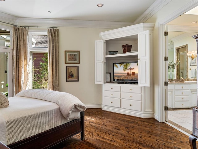 bedroom with dark wood finished floors, ensuite bath, crown molding, and access to outside