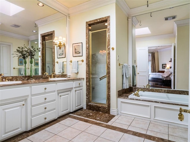 ensuite bathroom featuring a sink, connected bathroom, a shower stall, and tile patterned flooring