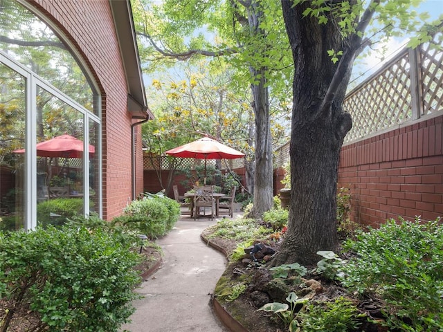 view of yard with a patio and fence