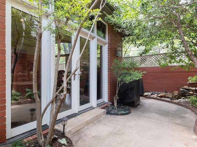 view of patio / terrace with entry steps and fence