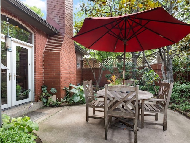 view of patio / terrace featuring outdoor dining area and fence