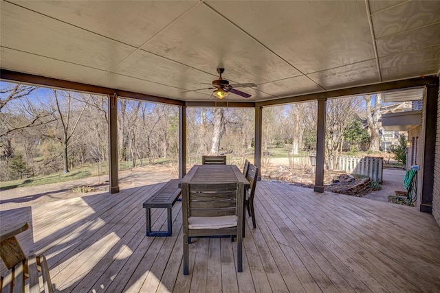 deck featuring outdoor dining area and ceiling fan