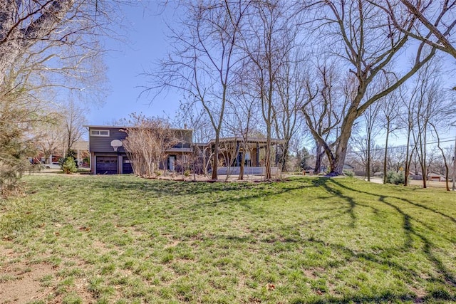 view of yard with a garage