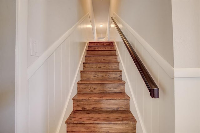 stairway with a decorative wall