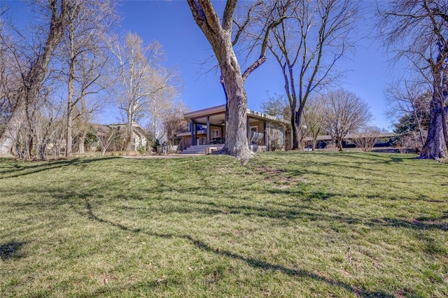 view of yard with covered porch