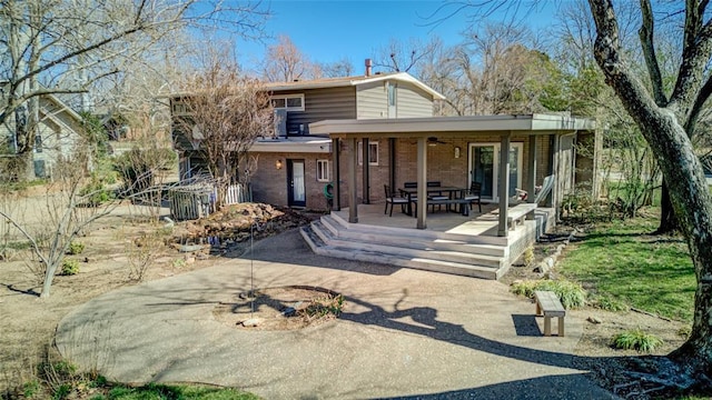back of house with brick siding