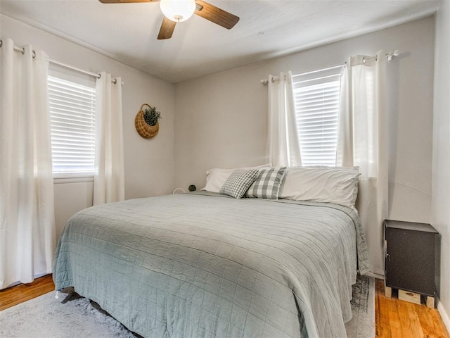 bedroom with wood finished floors and a ceiling fan