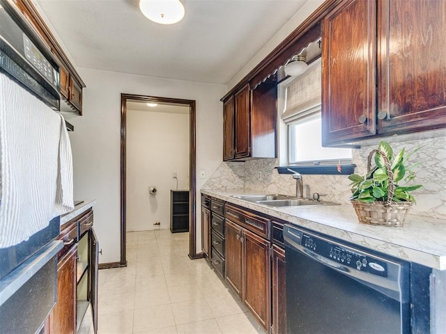 kitchen with a sink, backsplash, light tile patterned flooring, light countertops, and dishwasher