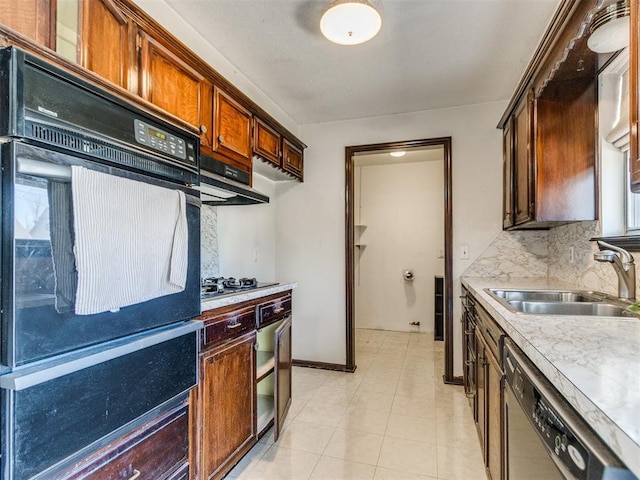 kitchen with black appliances, a sink, backsplash, light countertops, and baseboards