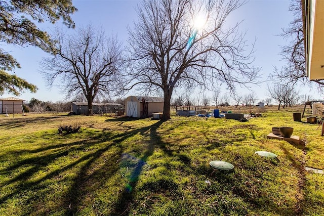 view of yard with a storage unit and an outdoor structure