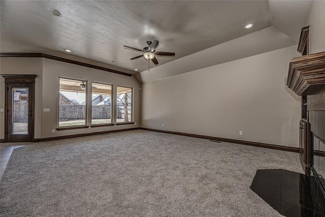 unfurnished living room with baseboards, vaulted ceiling, carpet flooring, recessed lighting, and a ceiling fan