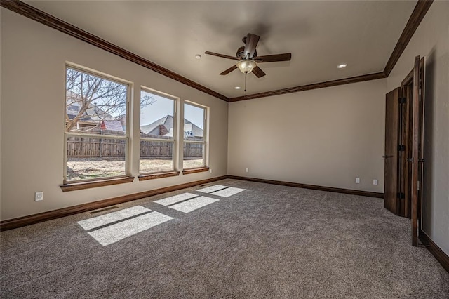 carpeted spare room featuring visible vents, ornamental molding, recessed lighting, baseboards, and ceiling fan