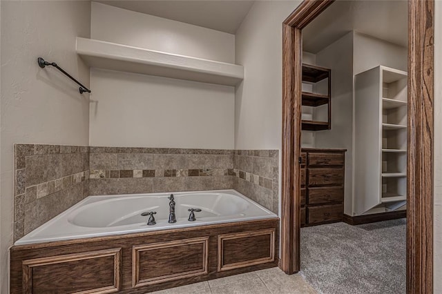 full bathroom with tile patterned flooring and a garden tub