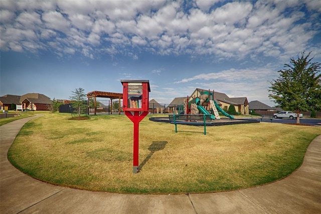 community jungle gym featuring a yard