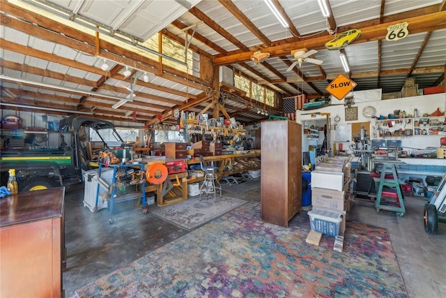 garage featuring a workshop area and metal wall