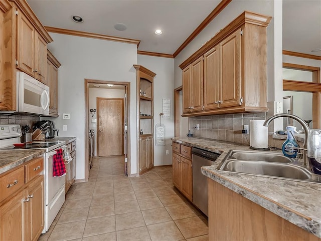 kitchen with a sink, white appliances, crown molding, light tile patterned floors, and decorative backsplash