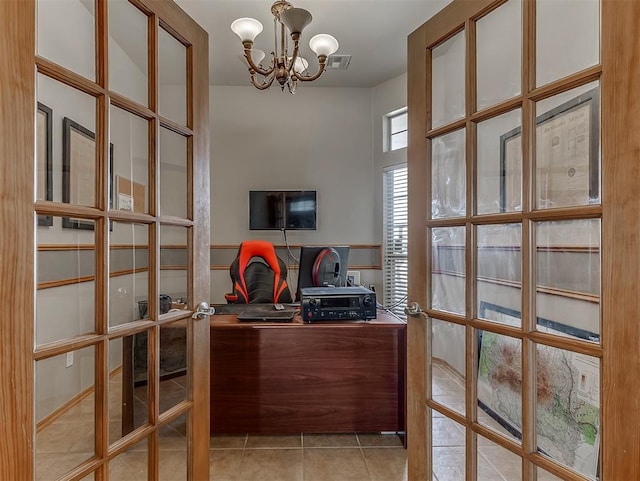 office space with an inviting chandelier, light tile patterned floors, french doors, and visible vents