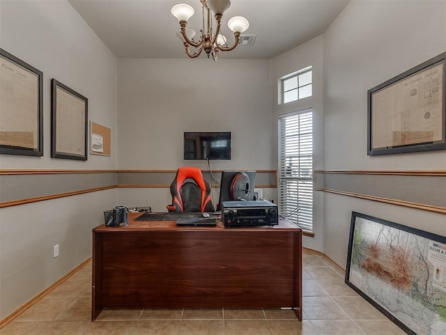 office with light tile patterned floors, a notable chandelier, baseboards, and visible vents