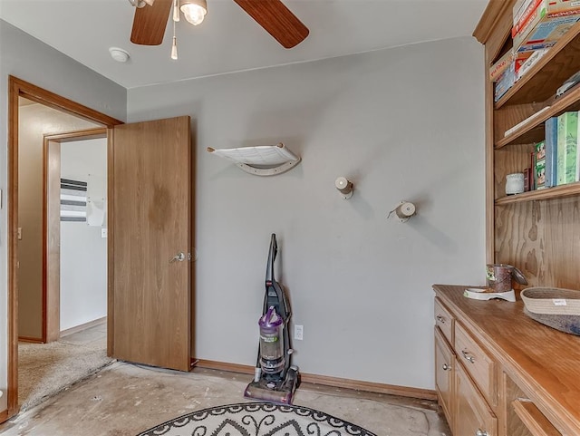 bathroom with baseboards, vanity, ceiling fan, and unfinished concrete floors