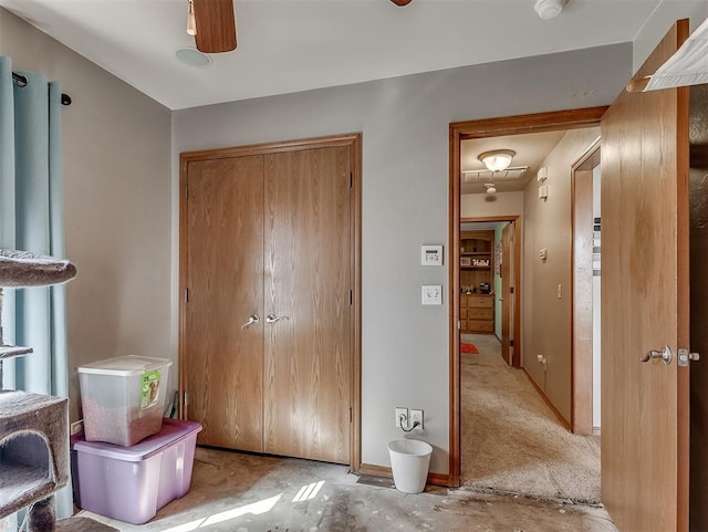 interior space featuring baseboards and a closet