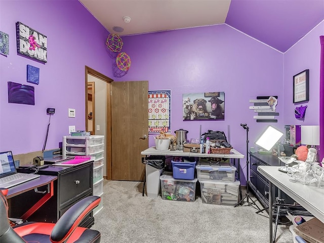 office space with carpet and vaulted ceiling