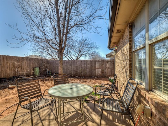 view of patio / terrace with outdoor dining space and a fenced backyard